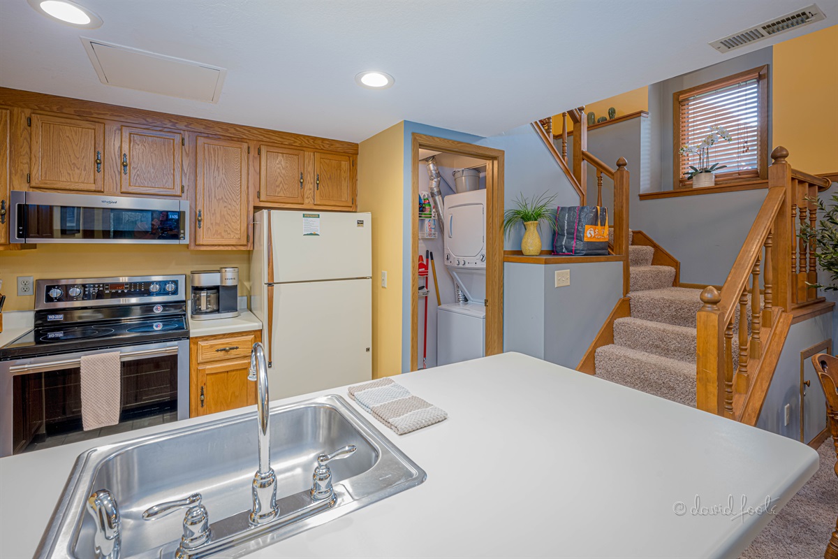 Well appointed kitchen and washer/dryer are downstairs