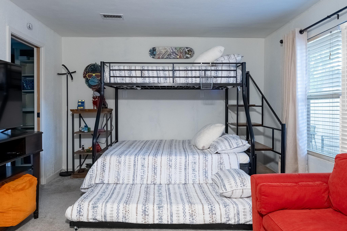 Twin on top bunk, full on bottom bunk and another twin trundle.