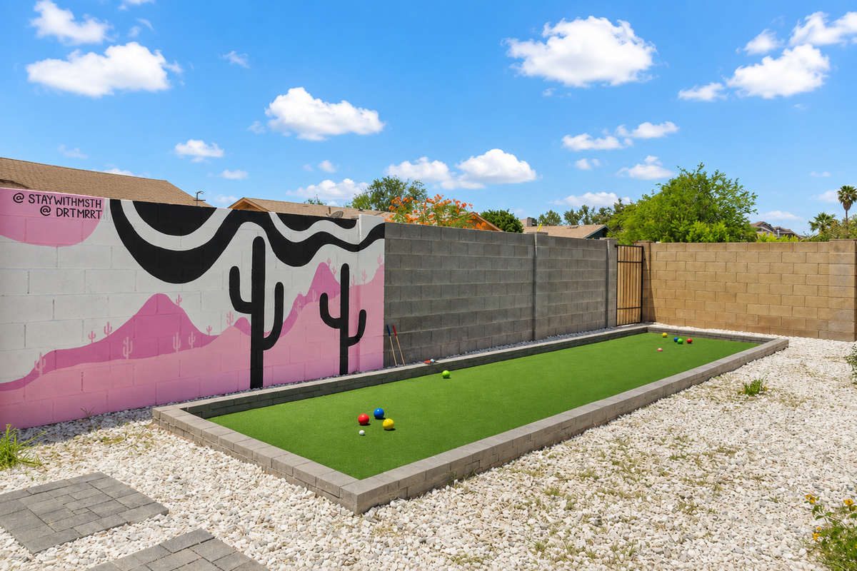 Enjoy this bocce ball and golf putting greein the back yard.