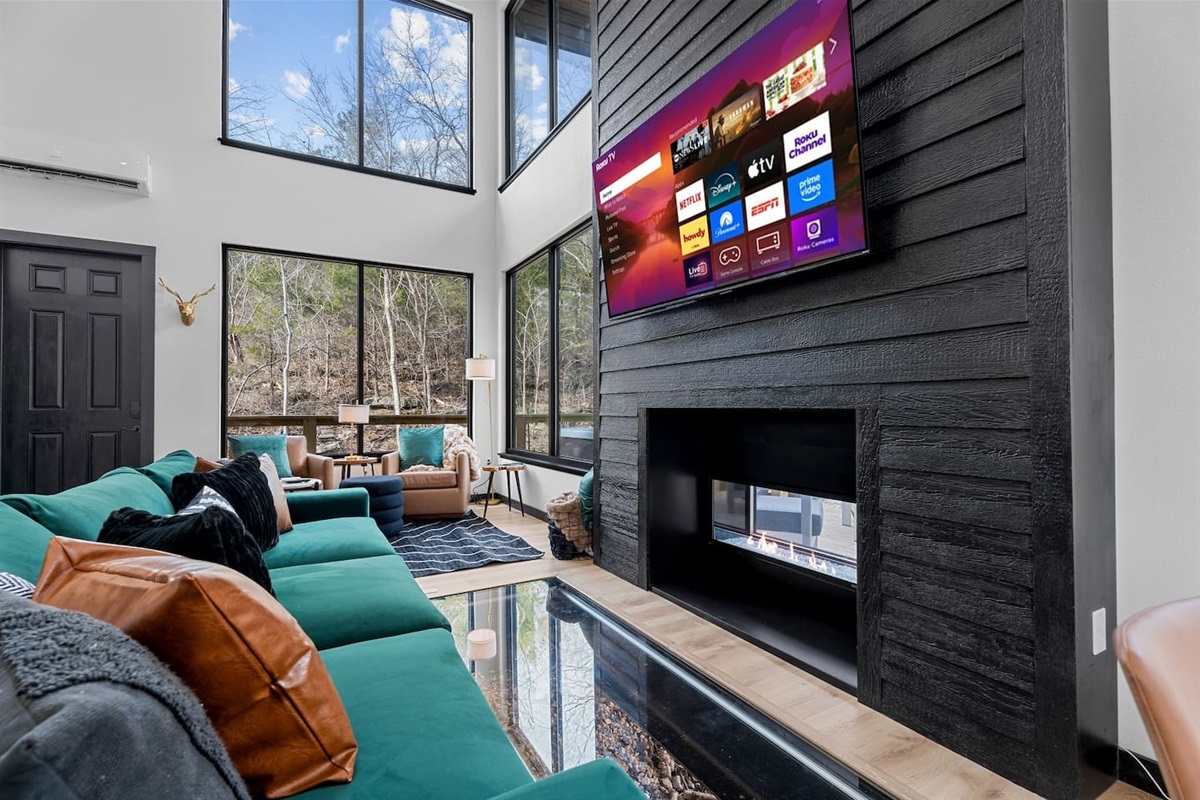 Walls of glass keep you fully connected to the creek and forest