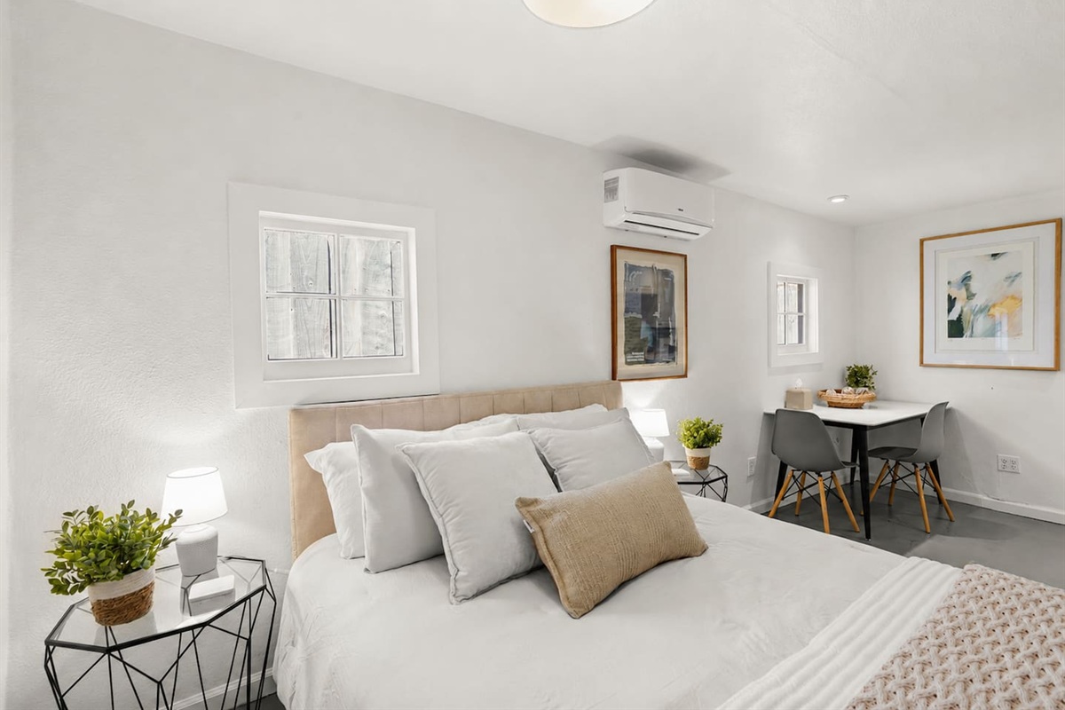 Bedroom 3 features a cozy queen bed, inviting linens, and a calm, comfortable space designed for restful nights.