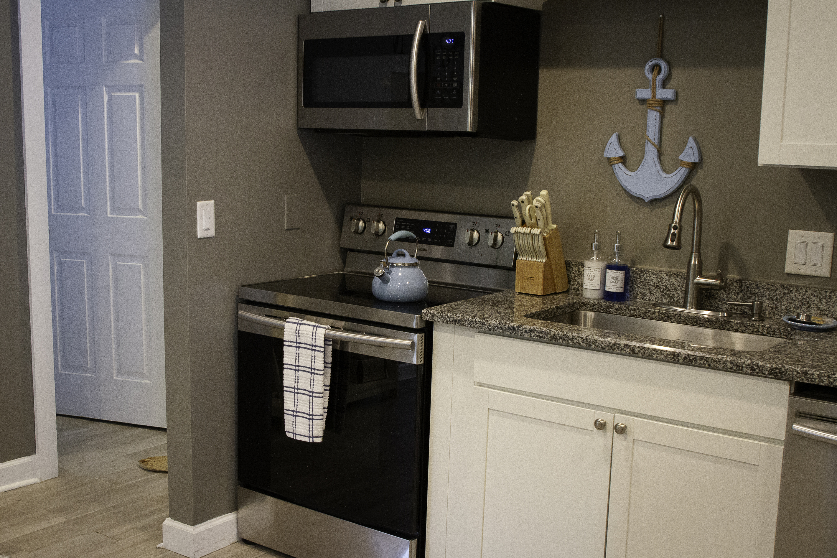 A view of the kitchen facing the stove