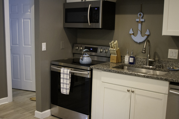 A view of the kitchen facing the stove