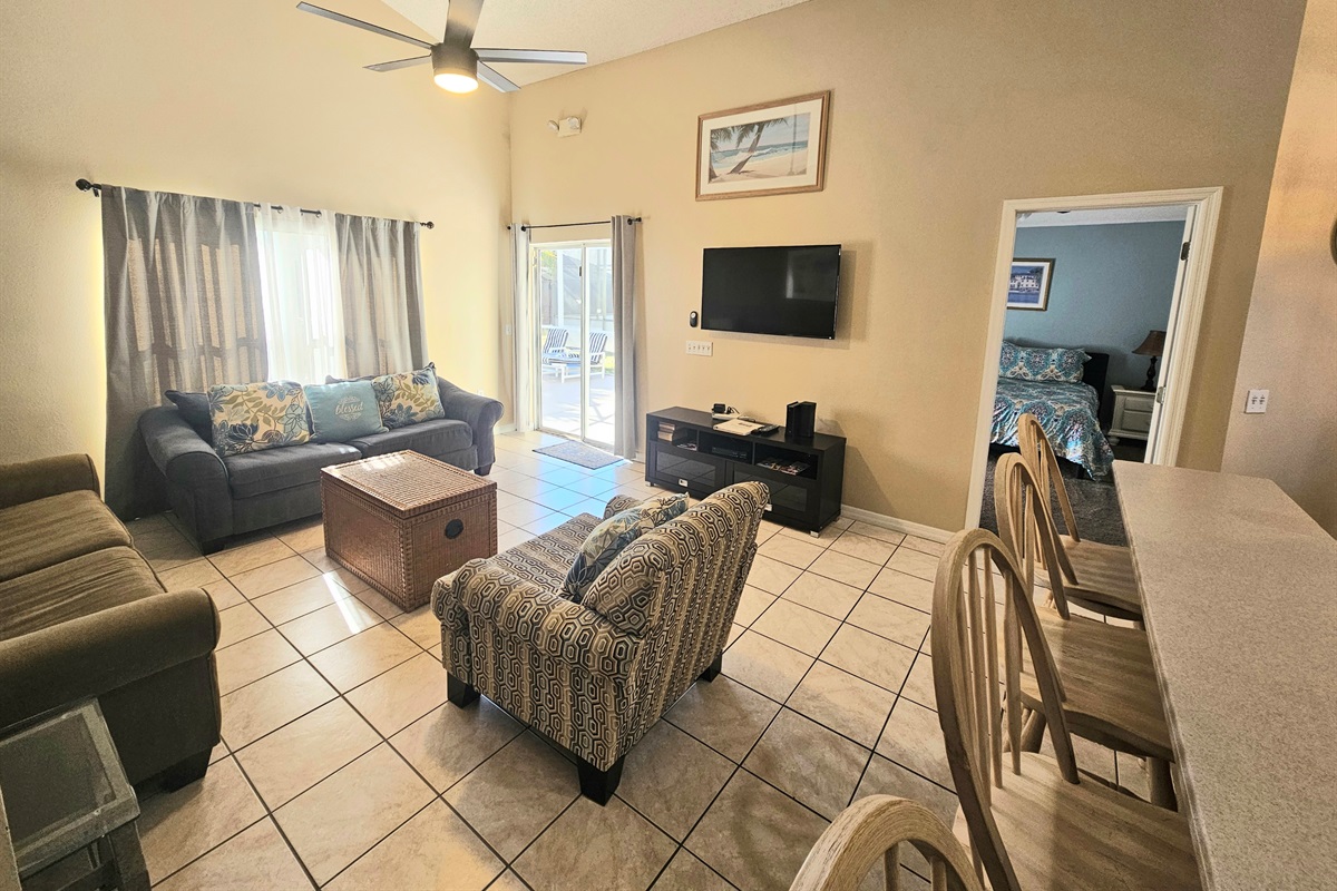 Living Room, TV, Ceiling Fan and access to Pool Deck