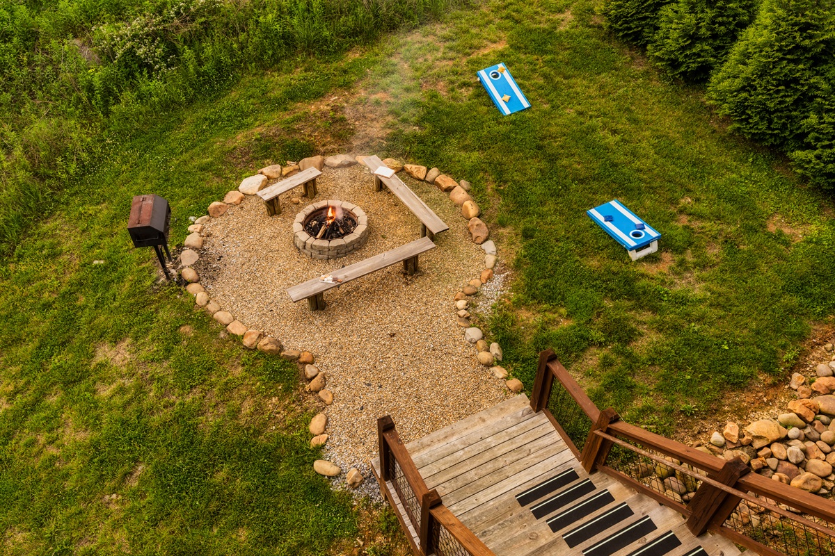 Backyard with firepit and cornhole