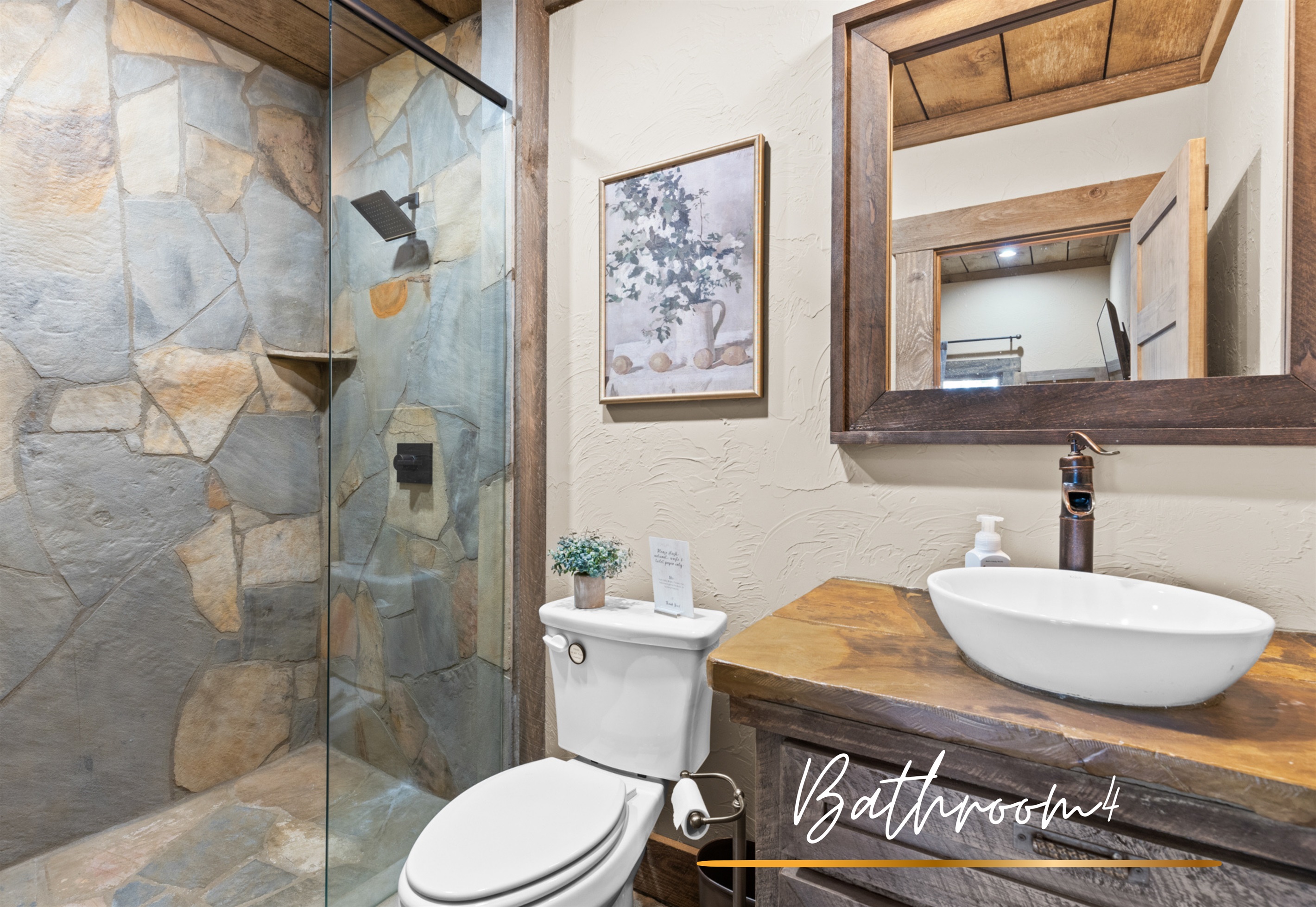 Bathroom 4: A rustic-inspired bathroom with modern amenities, ideal for getting ready with ease and style.
