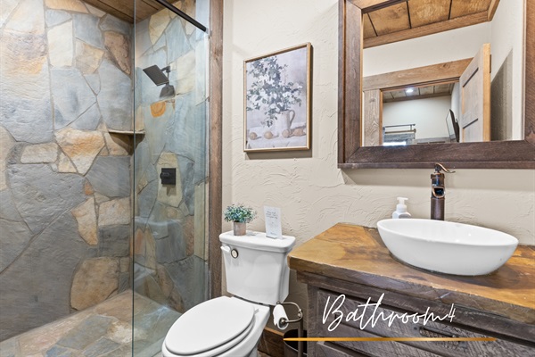 Bathroom 4: A rustic-inspired bathroom with modern amenities, ideal for getting ready with ease and style.