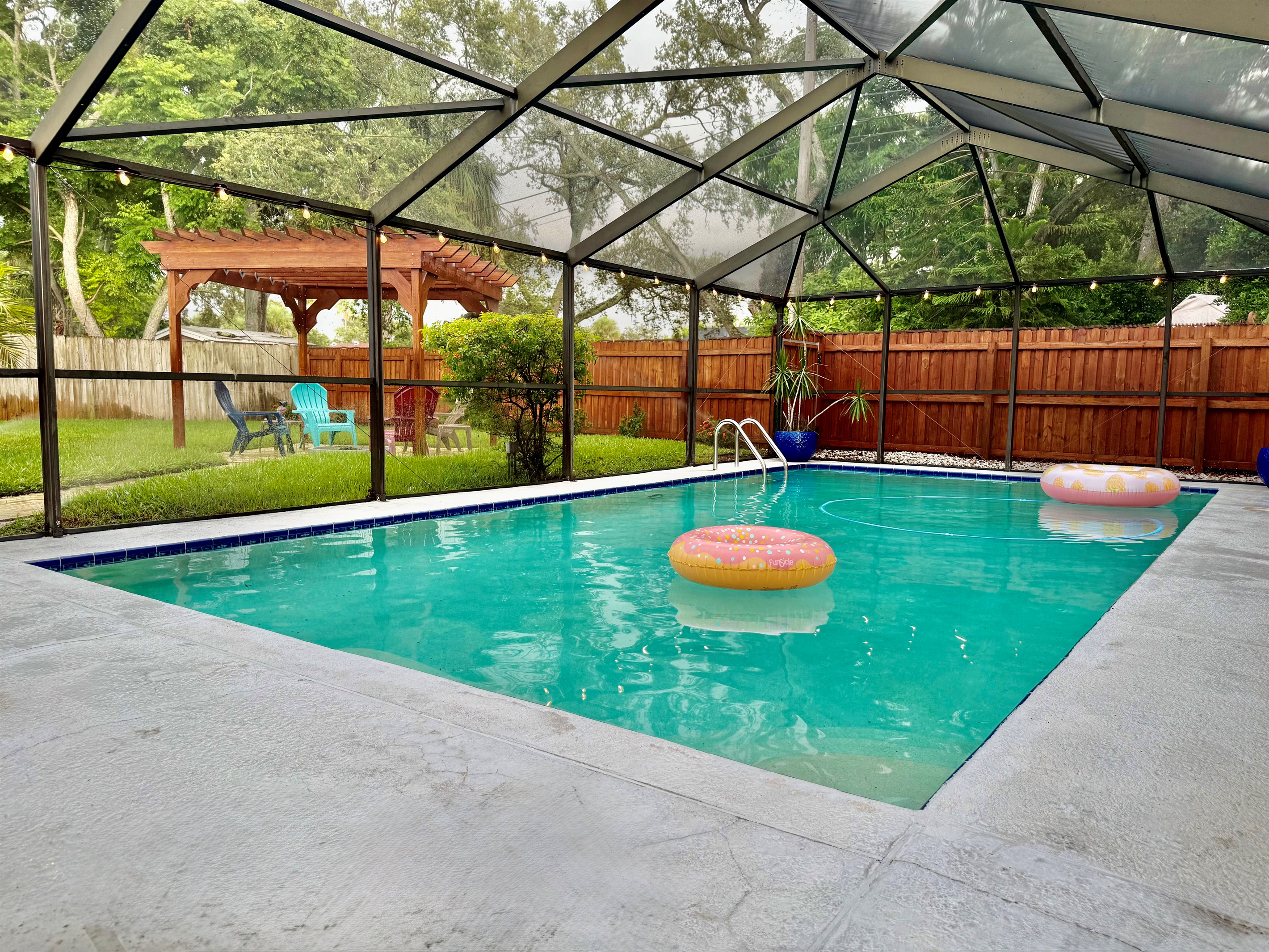 Enjoy tranquil dips in this sparkling screened pool, ideal for morning laps or quiet afternoon lounging.