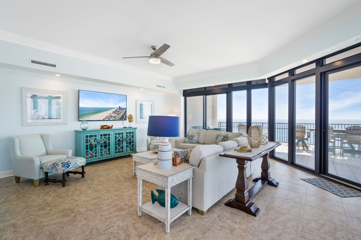Family Room with SmartTV and floor to ceiling windows with view of the Gulf