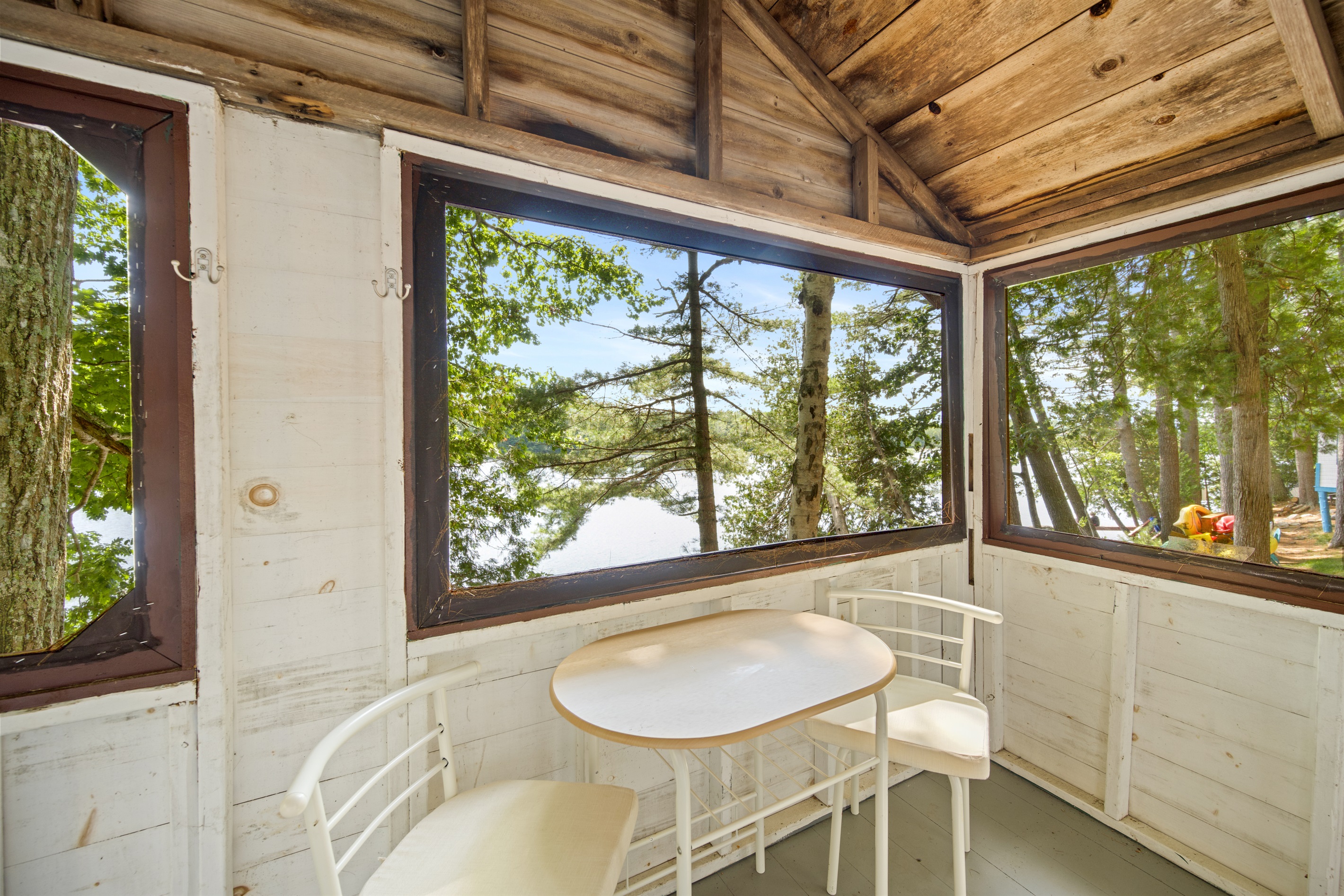 Indoor living with dining set wit lake view