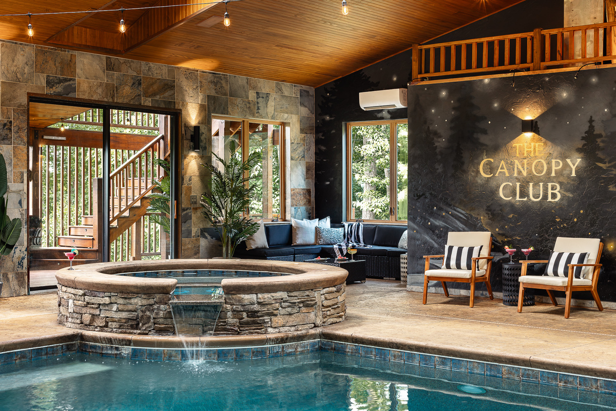 {Indoor Hot Tub} Soak in the oversized hot tub while staying right in the middle of the pool-house fun—perfect after a day of hiking and waterfall chasing.
