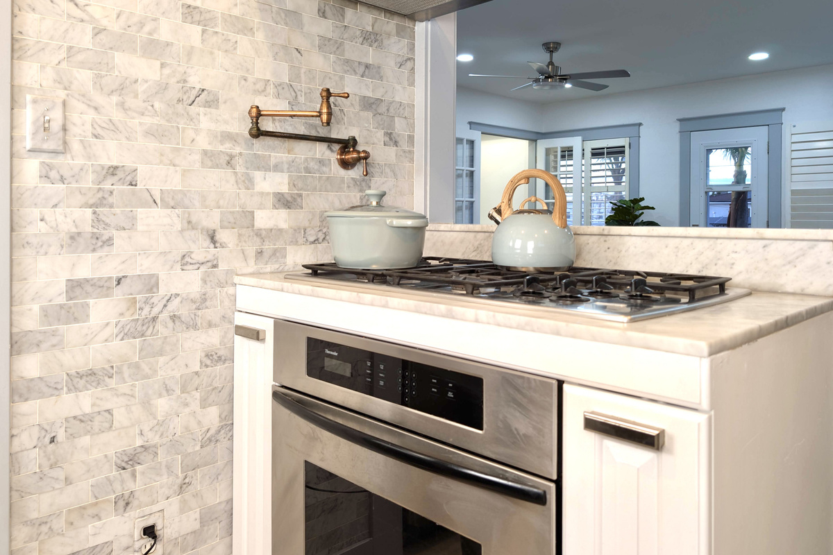 Cook with ease in this beautifully updated kitchen featuring stainless steel appliances, a gas cooktop, and everything you need to prepare meals during your stay.