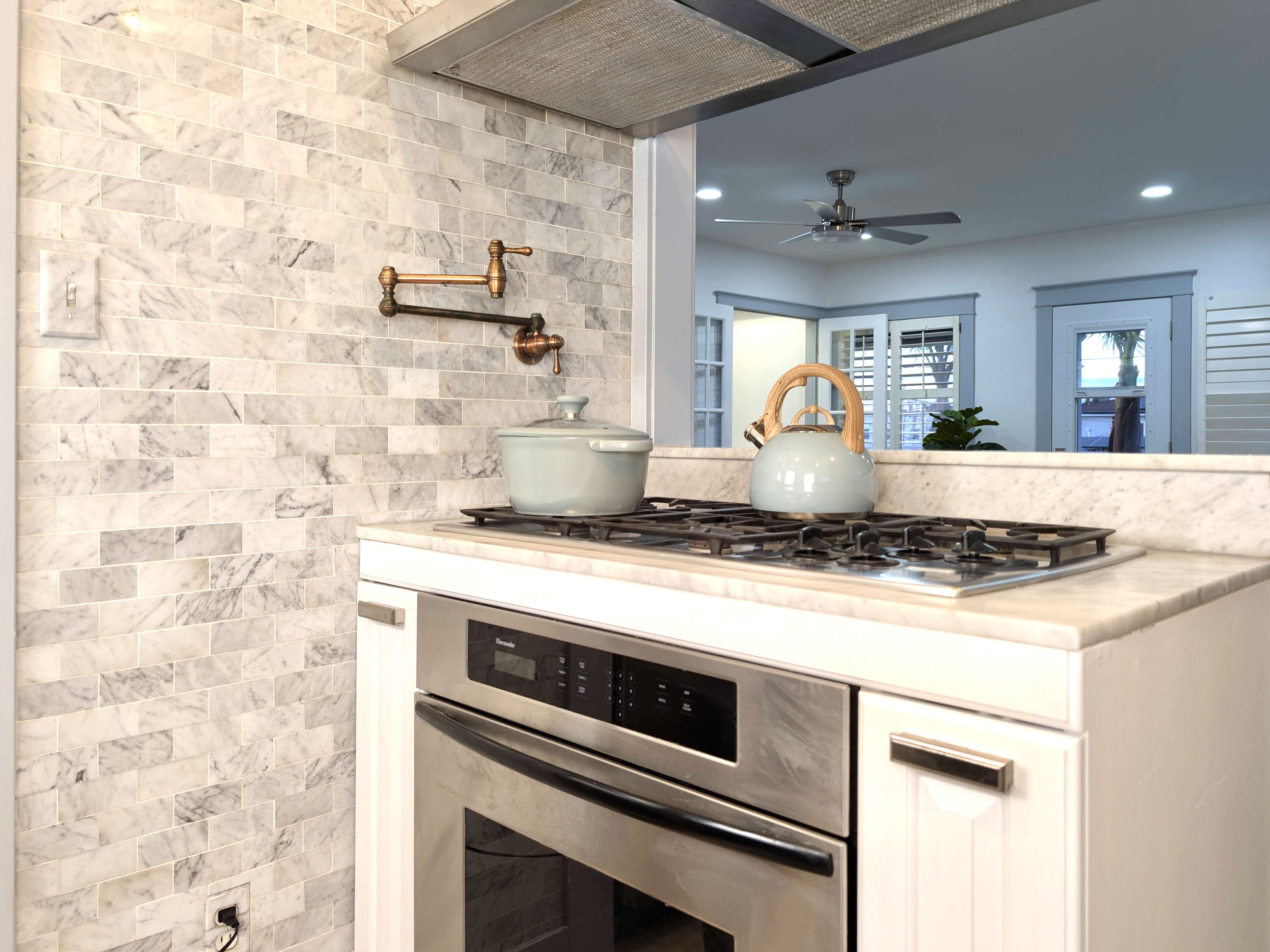 Cook with ease in this beautifully updated kitchen featuring stainless steel appliances, a gas cooktop, and everything you need to prepare meals during your stay.