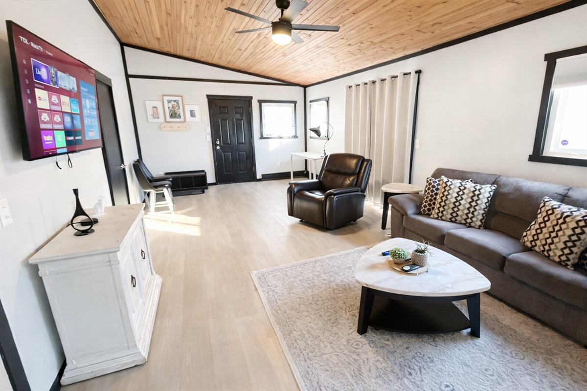 Spacious Living area features 55in Smart TV and plenty of seating for everyone