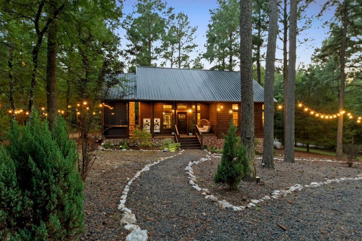 Unwind in nature beneath twinkling string lights and whispering pines—a true fairytale escape in the woods.