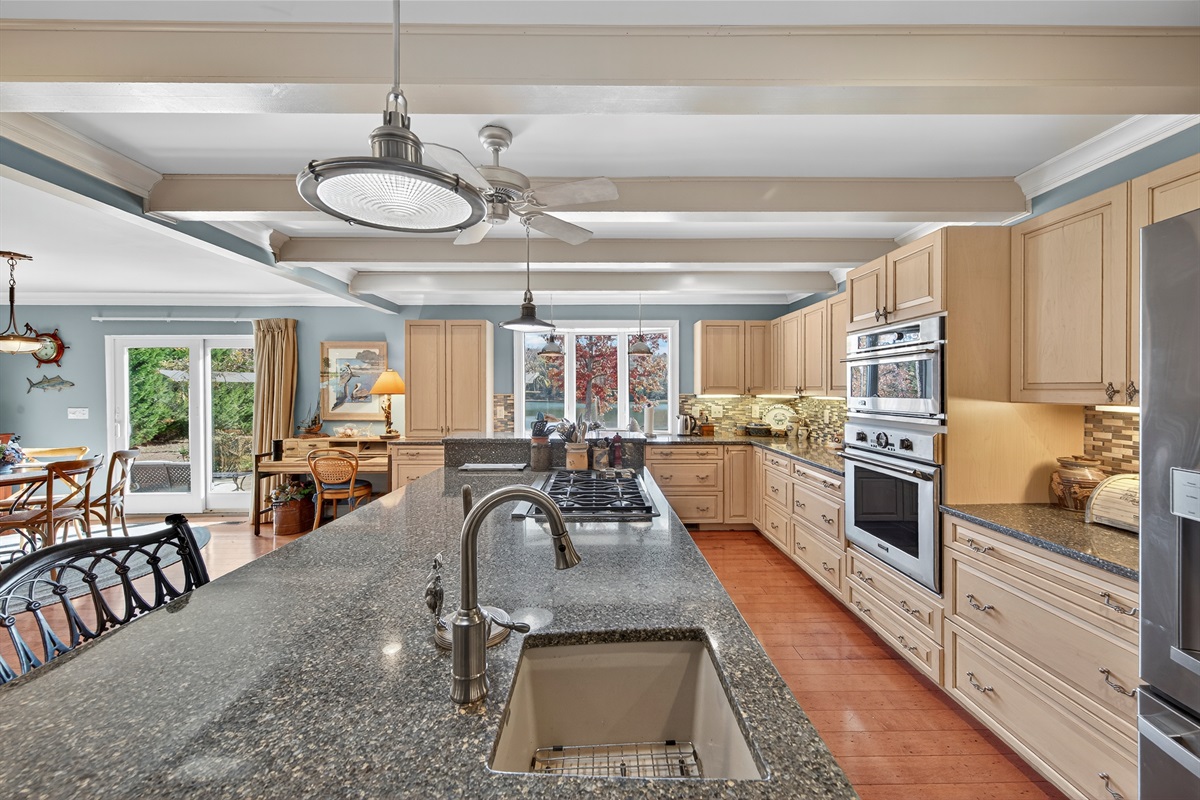 Expansive gourmet kitchen with a massive island and bar seating.