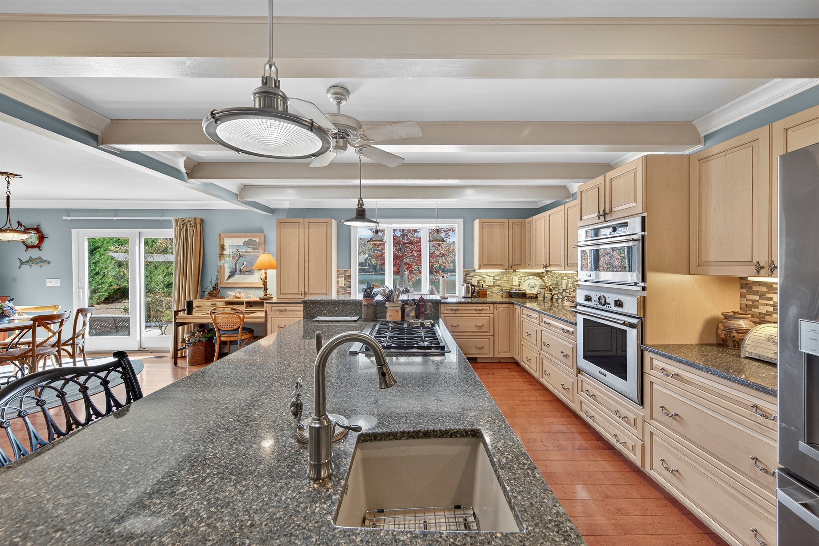 Expansive gourmet kitchen with a massive island and bar seating.