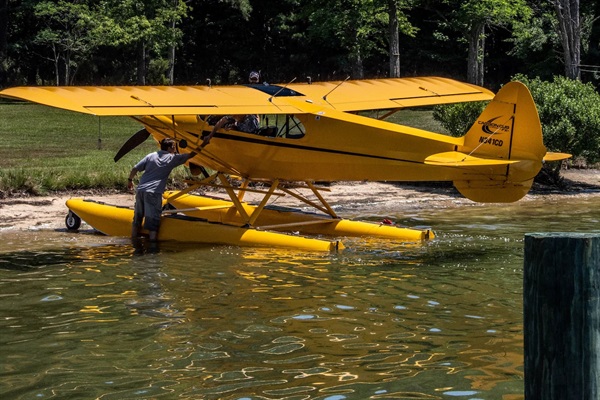 Super cub on floats parked at the beach during the annual splash in