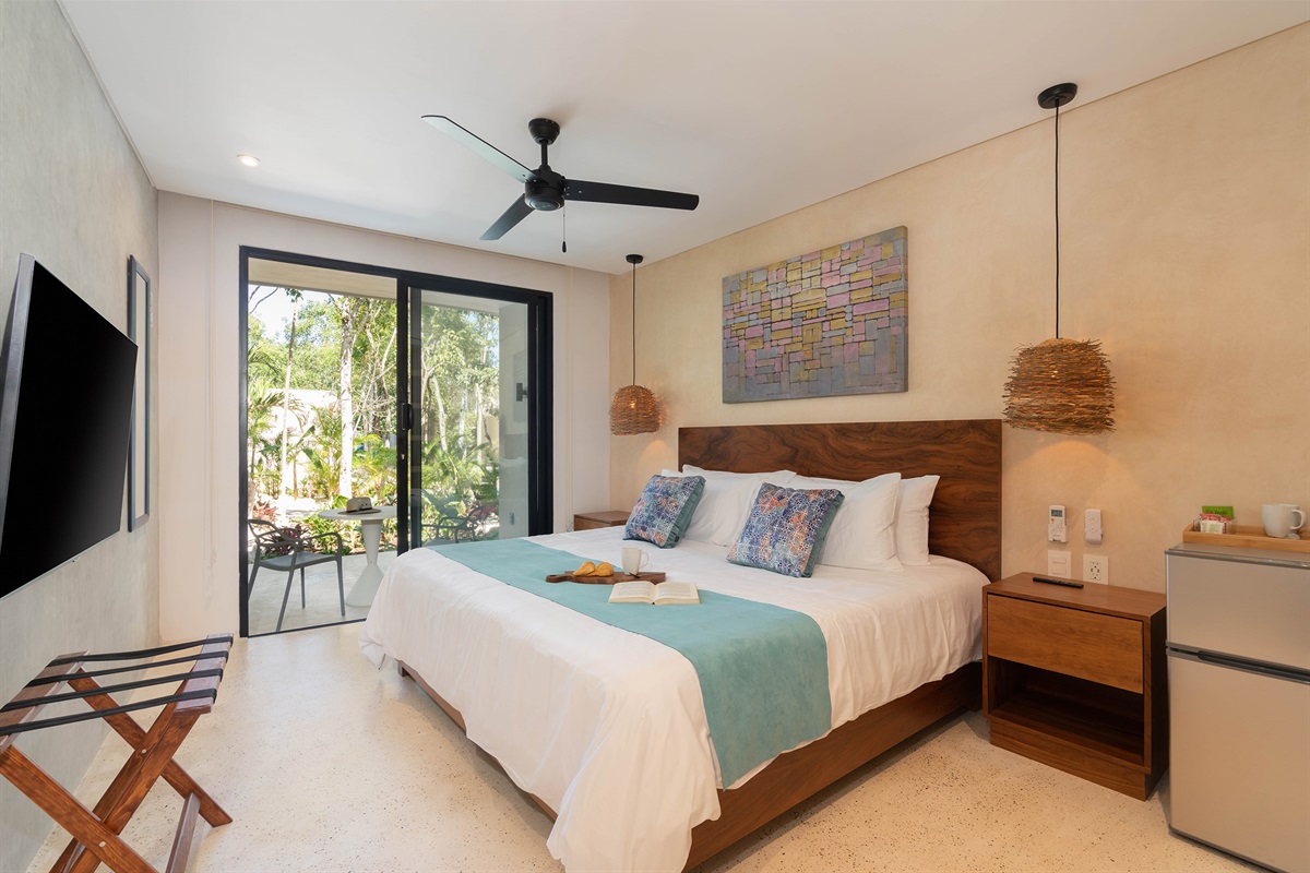 King sized bed with pool view