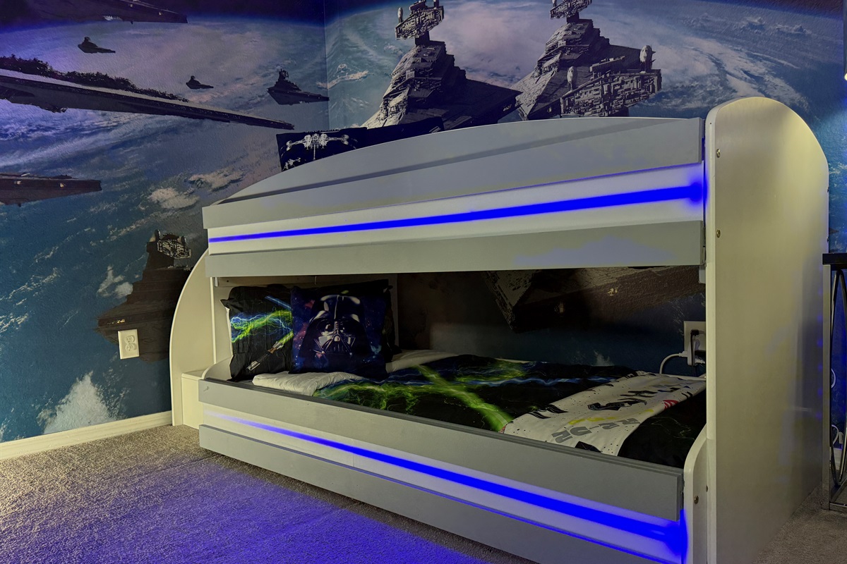 🌌 A galaxy of fun awaits! Our Star Wars bunk room has LED lights, Xbox, retro games, and safe, kid-friendly bunk beds.
