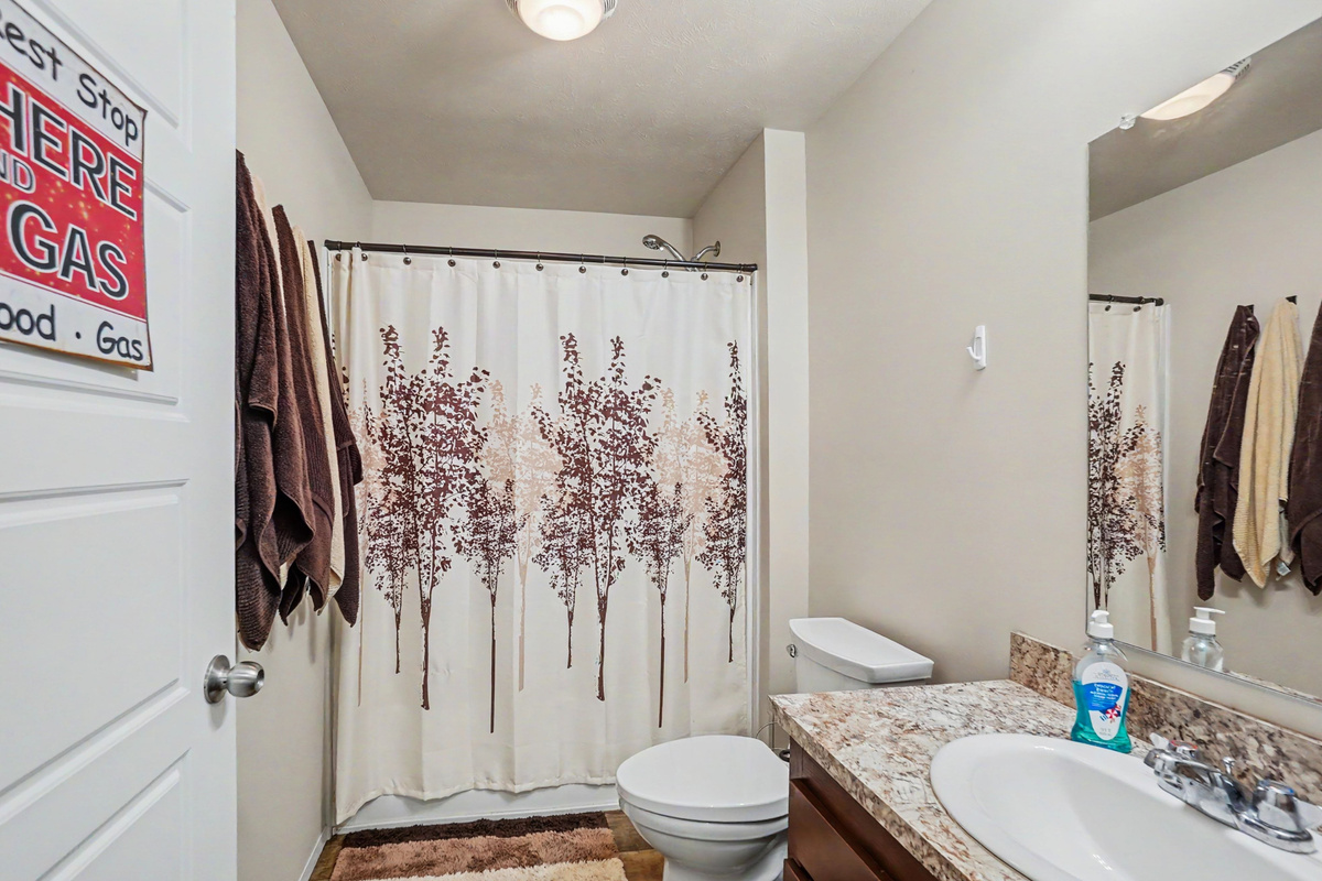 Ensuite bathroom with bathtub and shower combination.