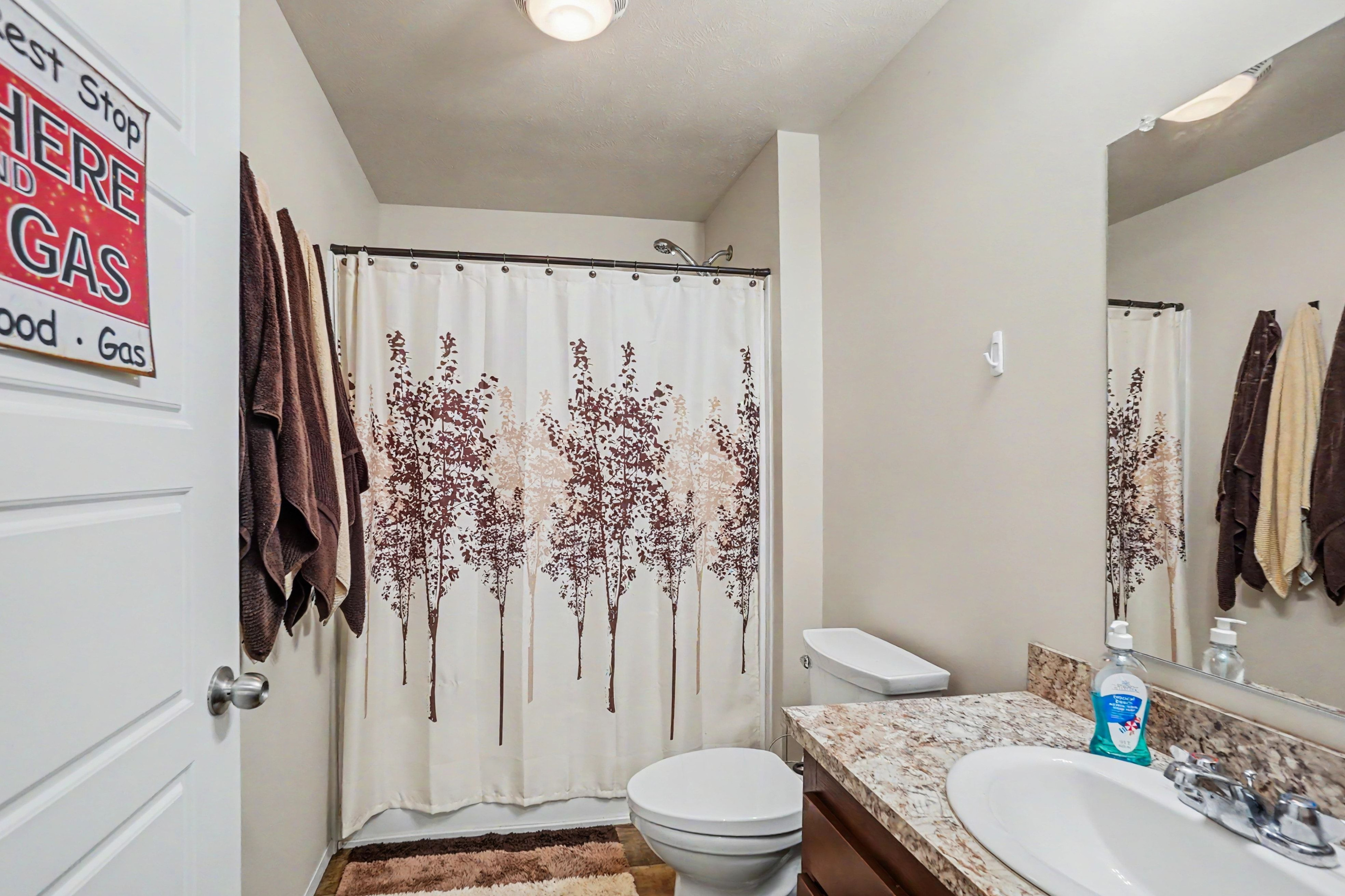 Ensuite bathroom with bathtub and shower combination.