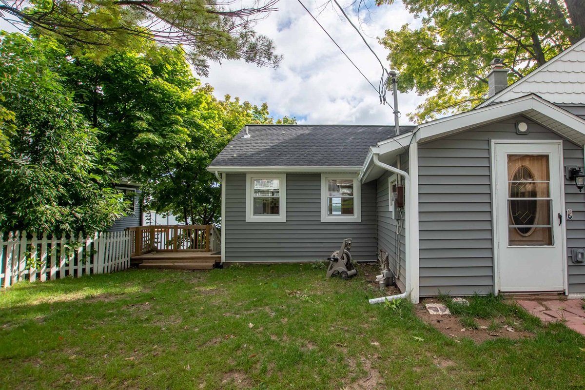 Side view of the home showcasing outdoor space and easy deck access.