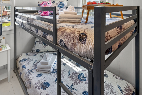 Bright and welcoming, this bunk room is designed for fun, comfort, and restful nights.