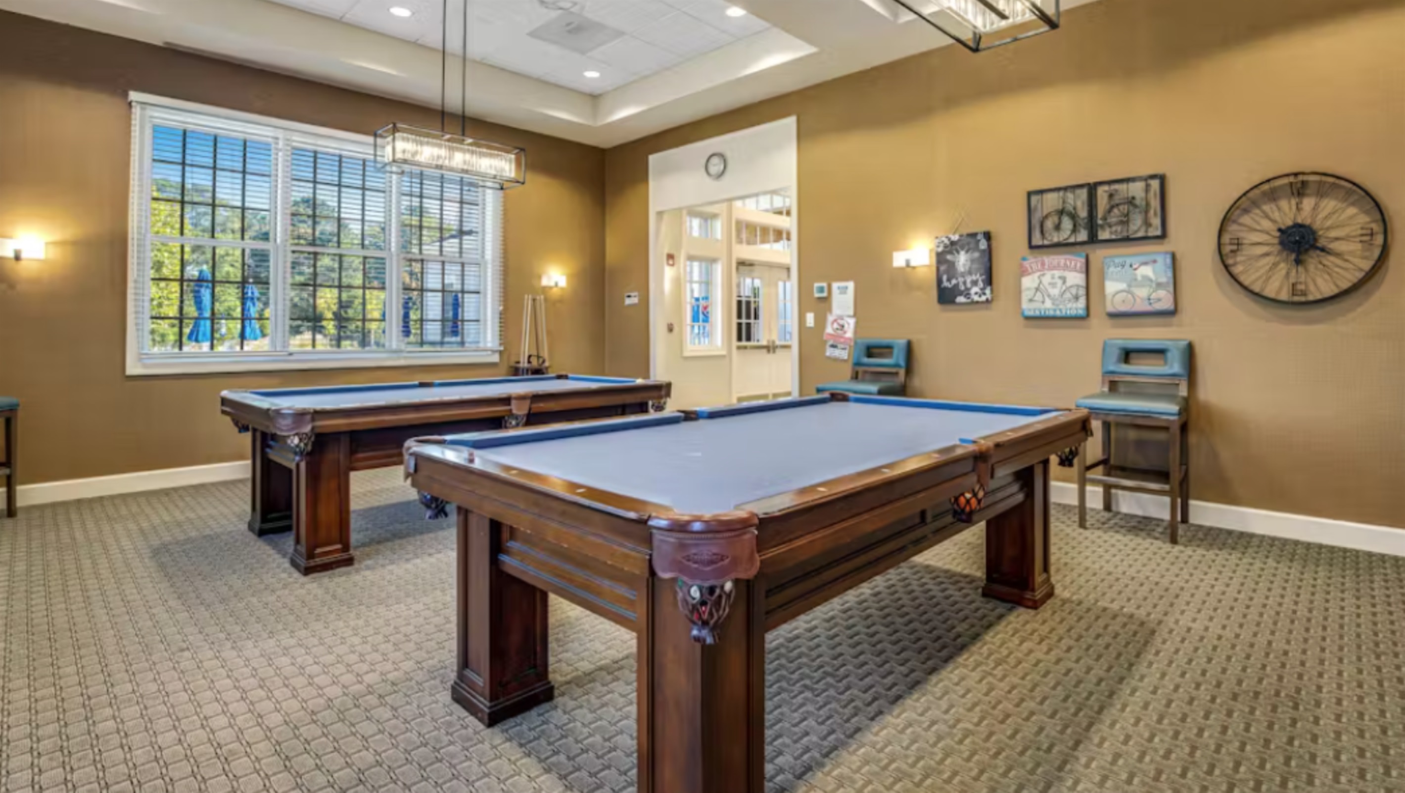 Classic Game Room: Challenge your crew to a friendly match on our full-size pool tables, illuminated by soft, ambient lighting for the ultimate game-night atmosphere.