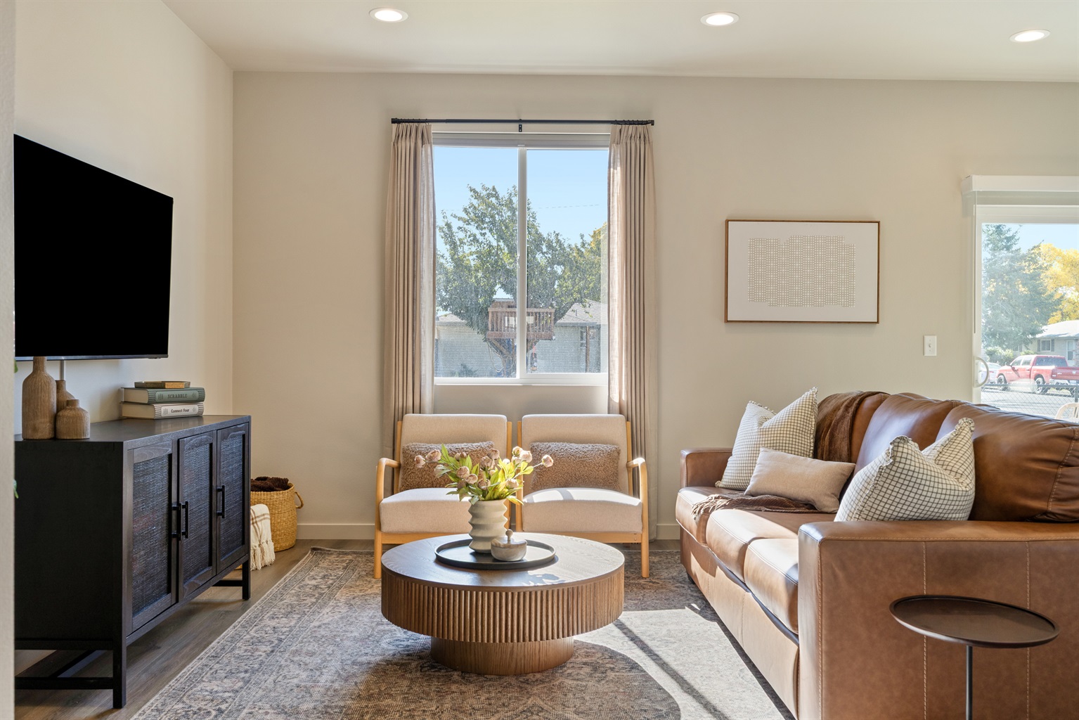 Cozy living room with sofa bed, board games, extra blankets