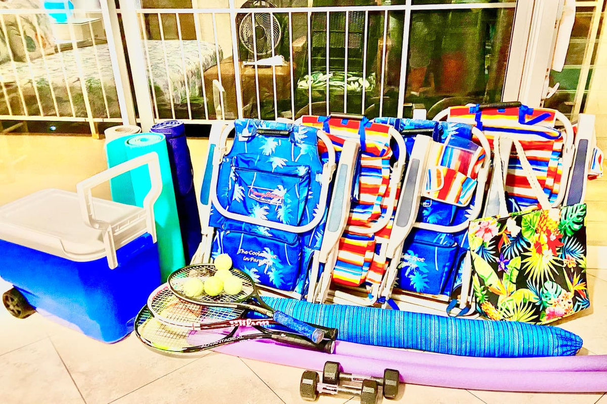We provide beach chairs, beach umbrella, cooler, beach bag, tennis rackets, tennis balls, 5 pound hand weights, and yoga mats.