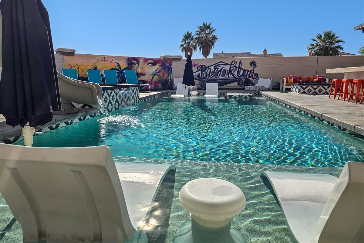 The 40' saltwater pool has oversized baja ledges on both ends of the pool and is approximately 5 feet deep in the middle.