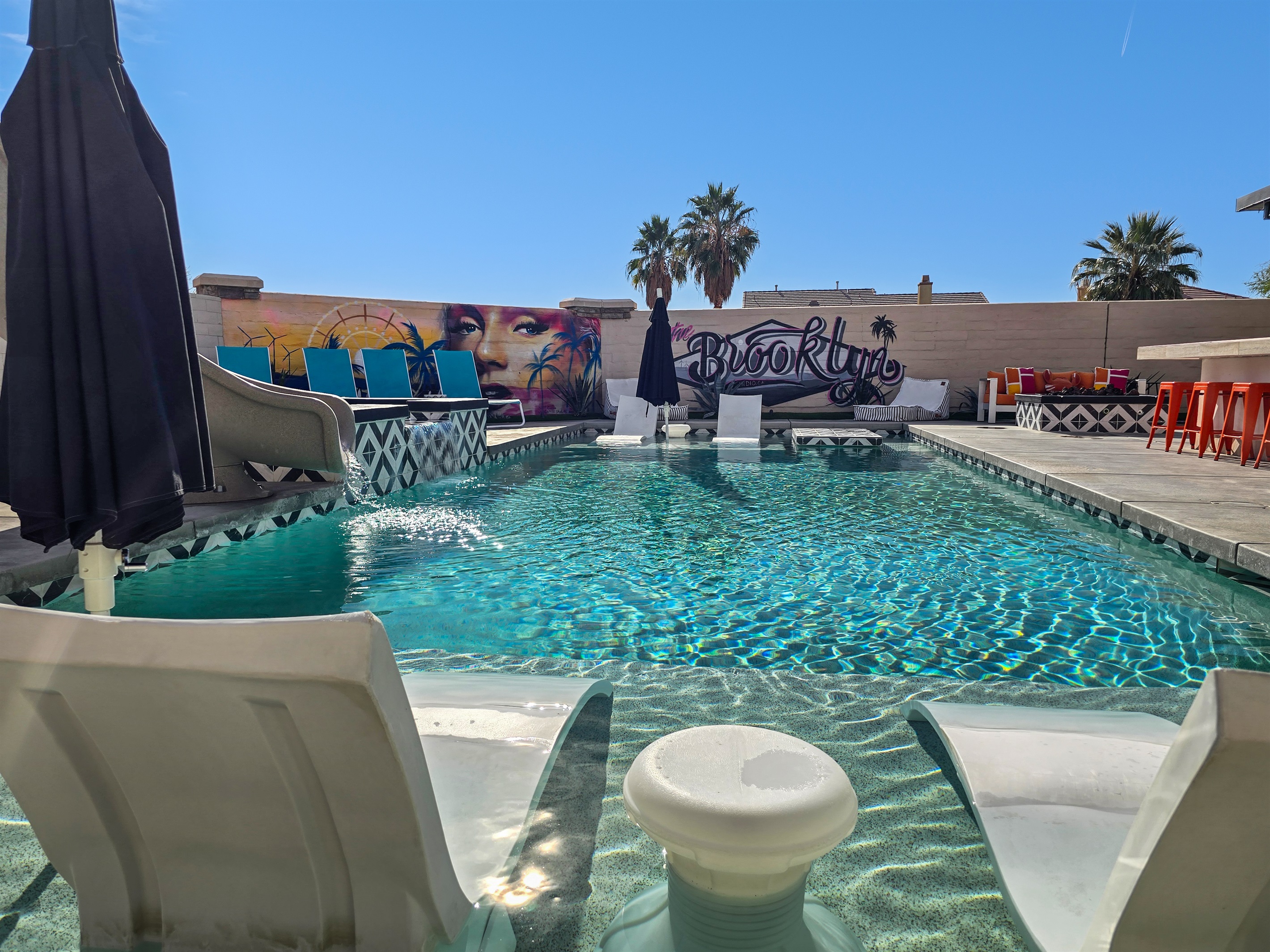 The 40' saltwater pool has oversized baja ledges on both ends of the pool and is approximately 5 feet deep in the middle.