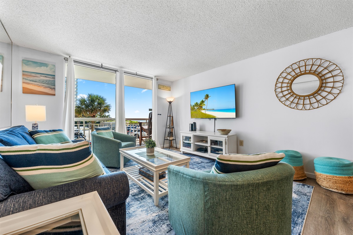 Large Living room area with balcony access and sleeper sofa
