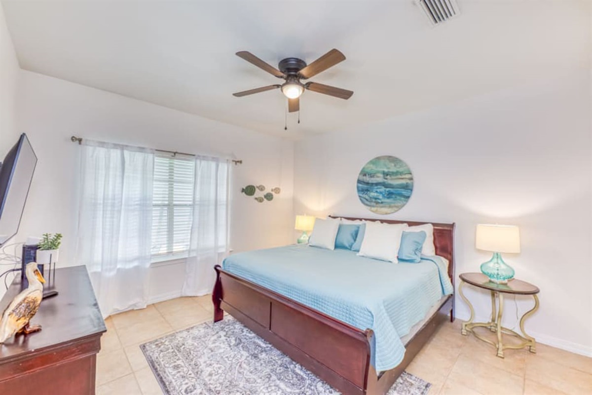Bedroom Retreat: Beachy decor meets modern comfort in this sunlit escape. Perfect for relaxation!