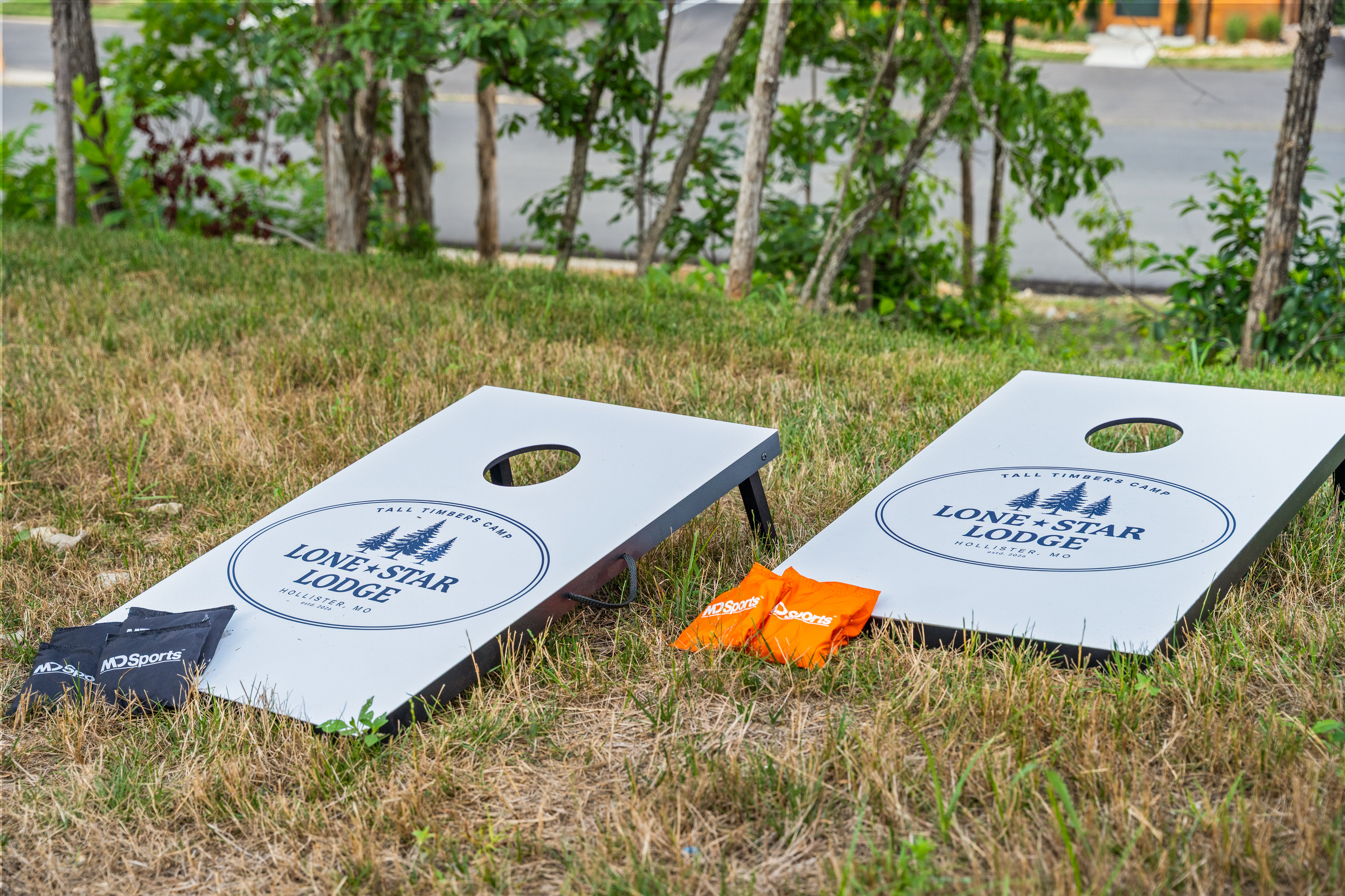 Toss a round of Lone Star Lodge cornhole from Tall Timbers Camp while the fire pit gets going.