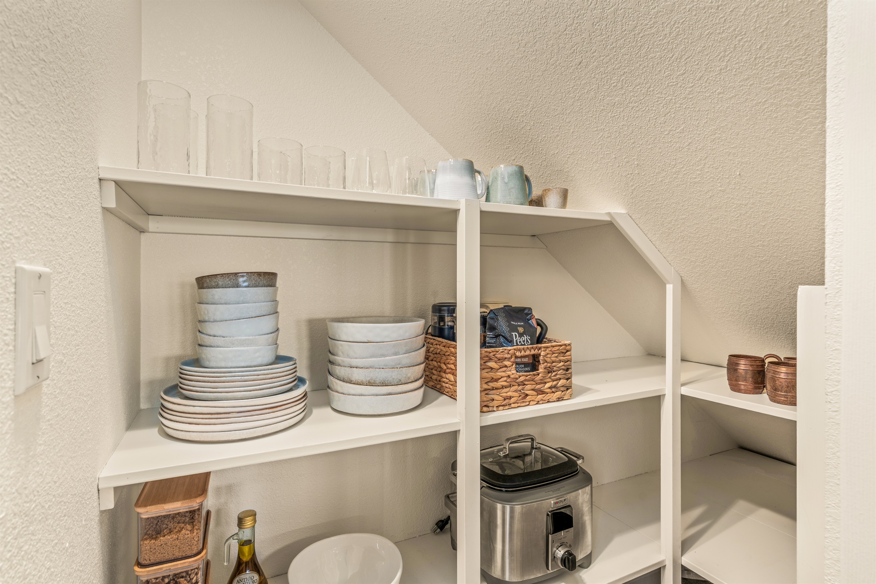 Abundantly stocked kitchen with premium dishware, silverware and appliances.