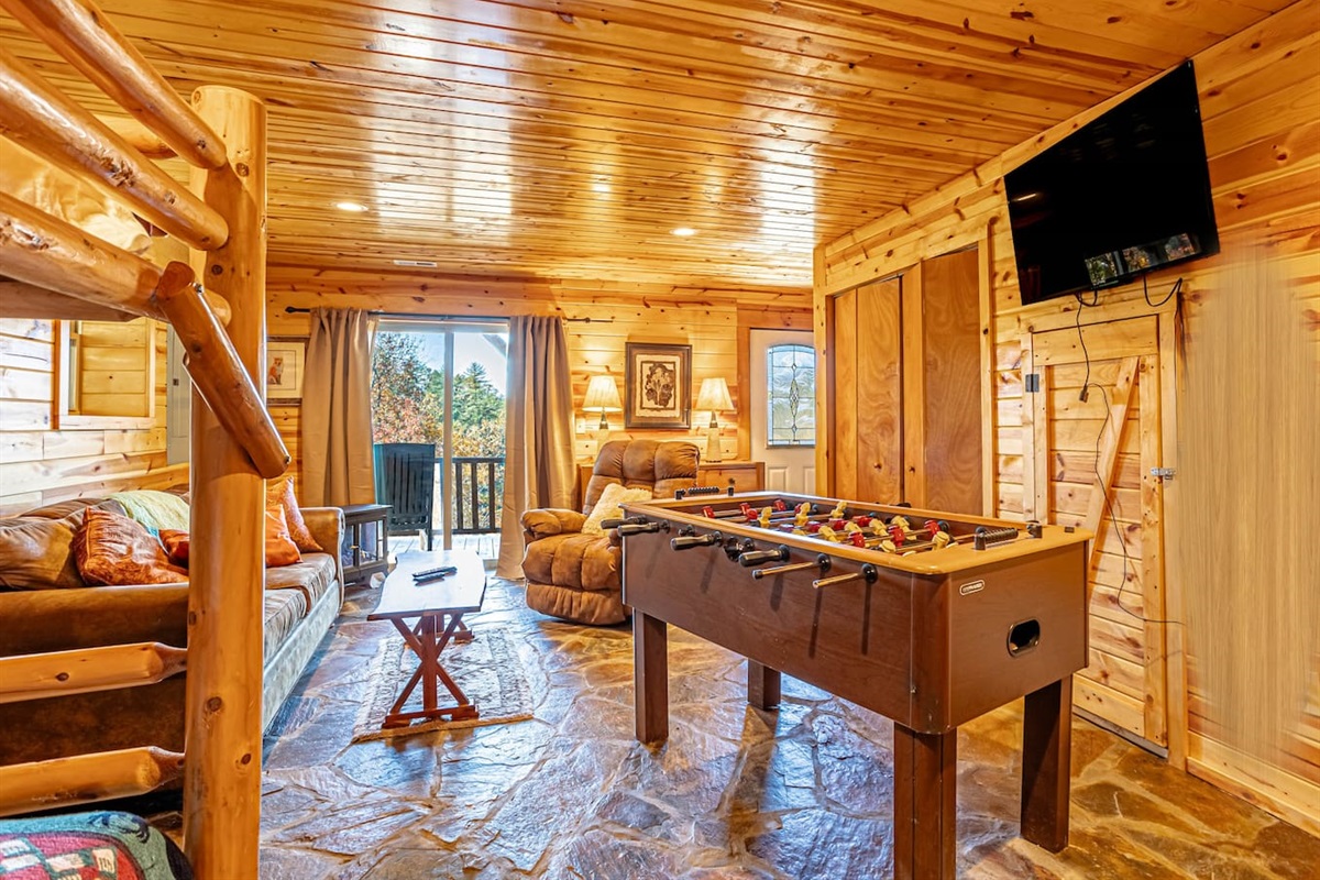 Lower level - 2nd living room with game room- open to large wrap around, fully enclosed lower deck. Lower deck has a gate that can be opened to access back yard.