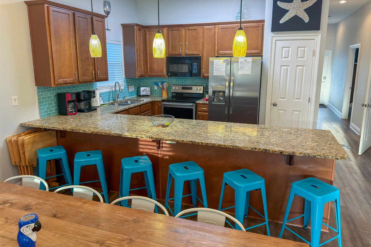 Additional breakfast bar seating for six makes hosting easy while keeping everyone connected.