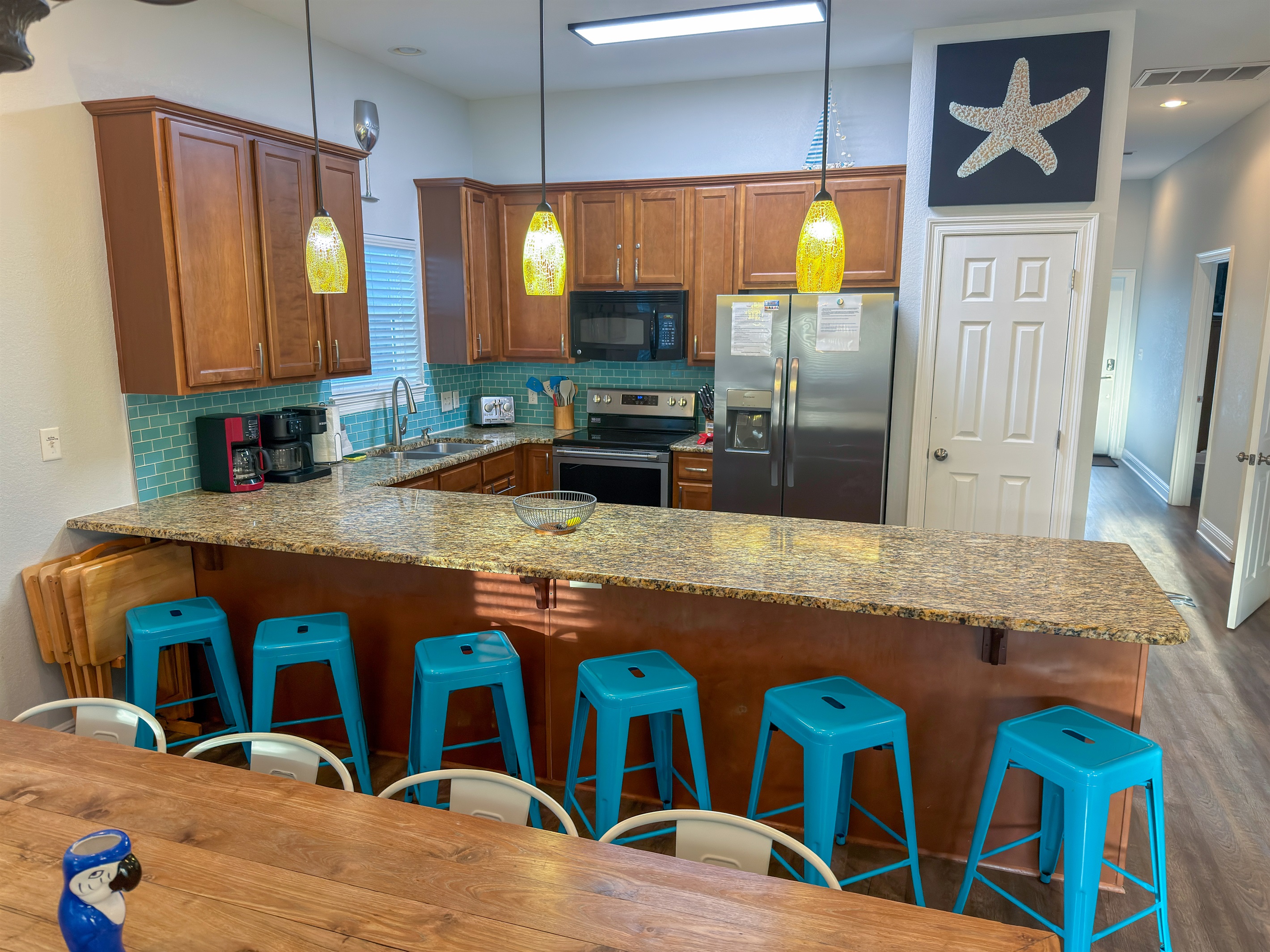 Additional breakfast bar seating for six makes hosting easy while keeping everyone connected.