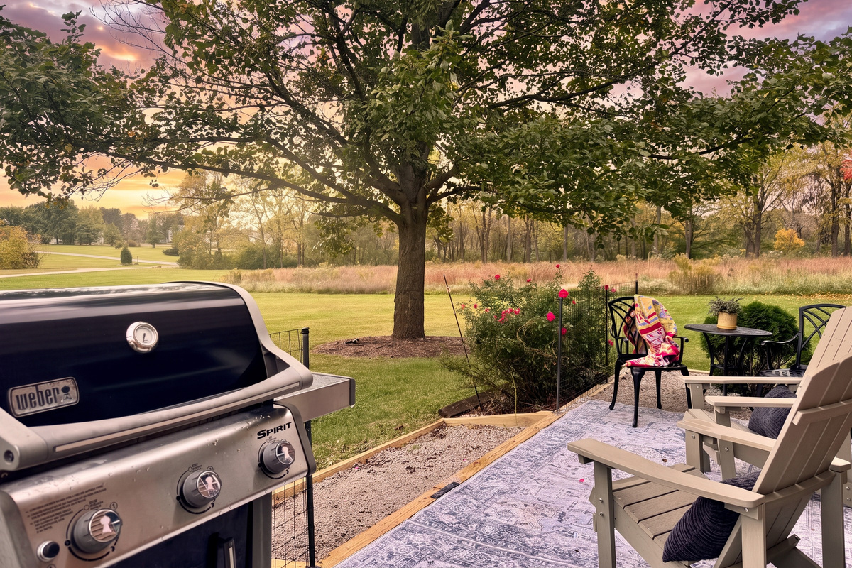Dedicated grill and patio seating area with bistro table