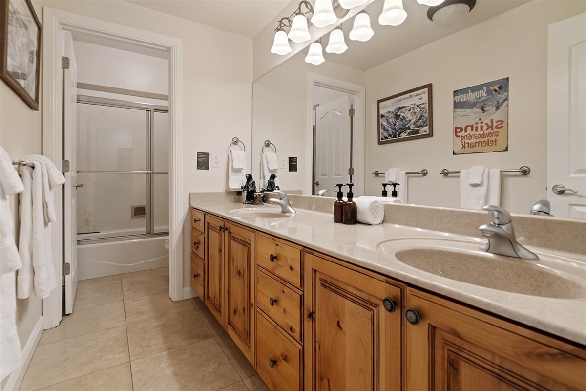 Ensuite bathroom with double vanities and tub/show combo. Plenty of space to store your things.