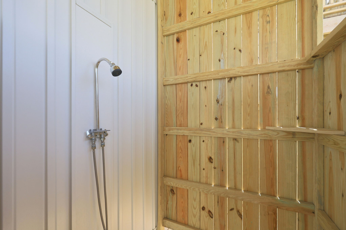 The private outdoor shower makes it easy to rinse away sand before heading inside after a day by the ocean