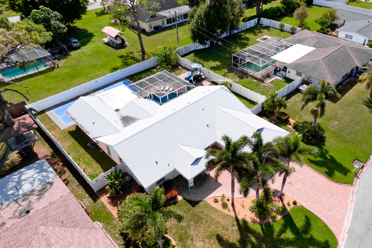 An aerial glimpse of your dream escape — where the pool glistens, the playset invites laughter, and the pickleball court promises hours of active fun. Everything you need for an unforgettable stay!