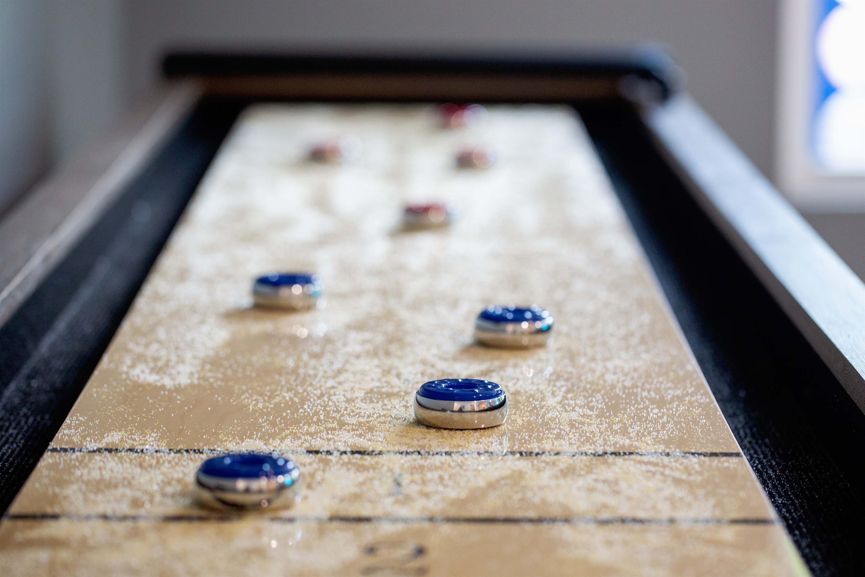 Challenge friends to a fun game on our sleek shuffleboard table!