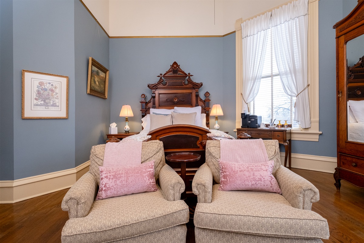 A second angle of the Eliza Suite highlighting period furnishings and classic architectural details.