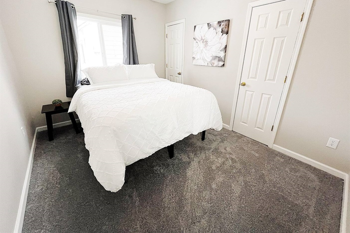 Bedroom with Queen Bed and Double Closets