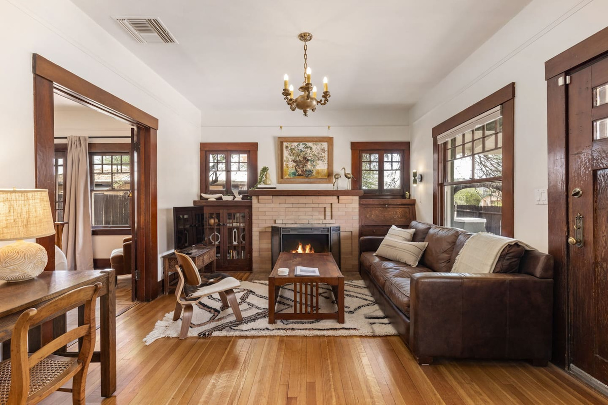 tastefully furnished living room with TV and decorative fireplace