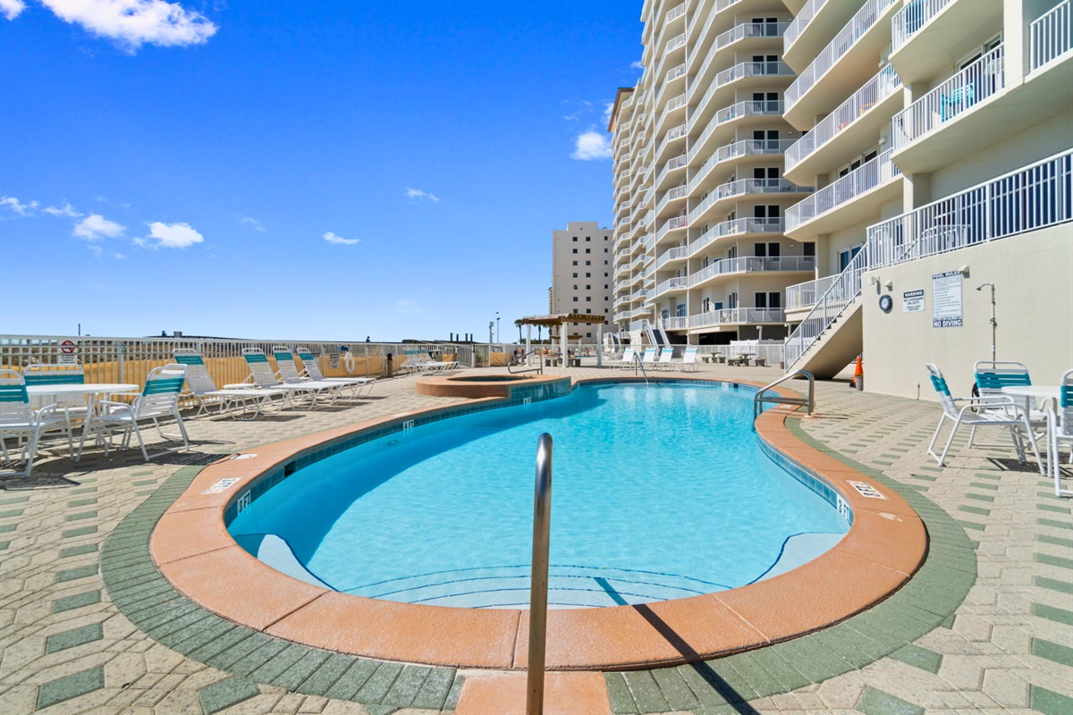 Spend sunny afternoons lounging by the beachfront pool, where Gulf views and warm sea breezes are always part of the experience.