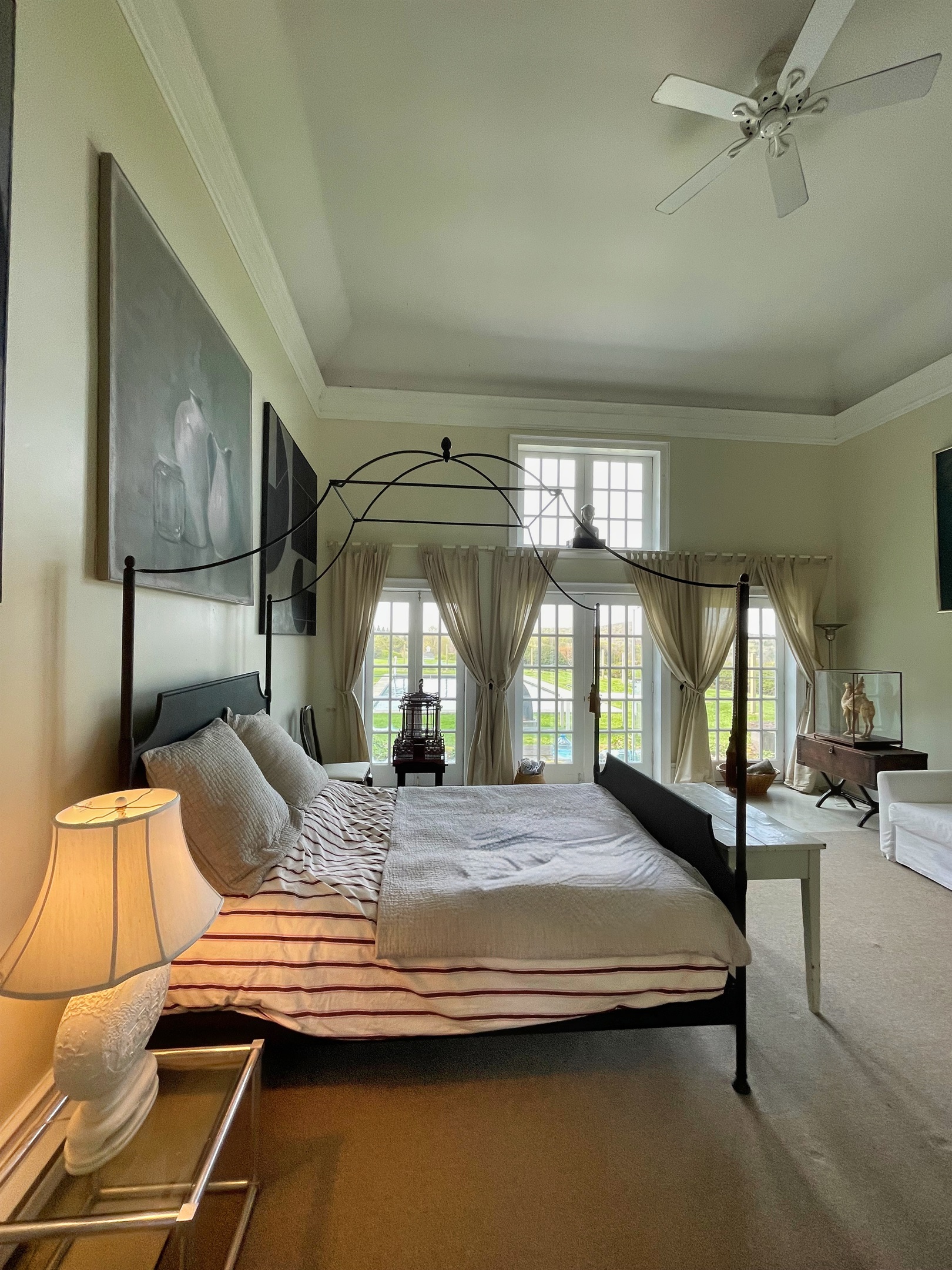 Hawk Field Pool House main space with French doors leading to the pool area.